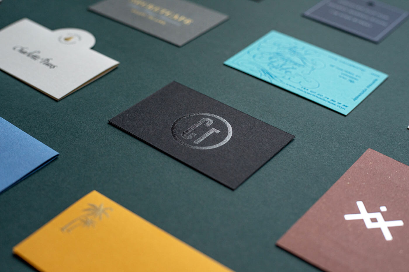 an array of gold and silver embossed die stamped engraved business cards and stationery
