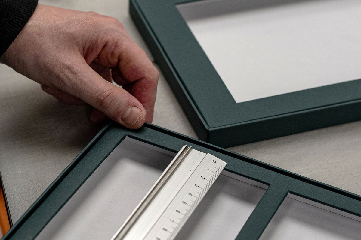 a mayfair box designer crafting and measuring a box for housing luxury stationery