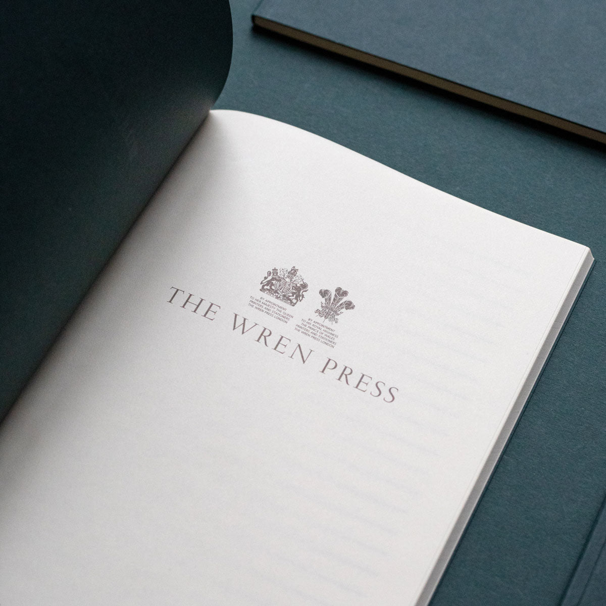 royal warrants printed inside a luxury notebook
