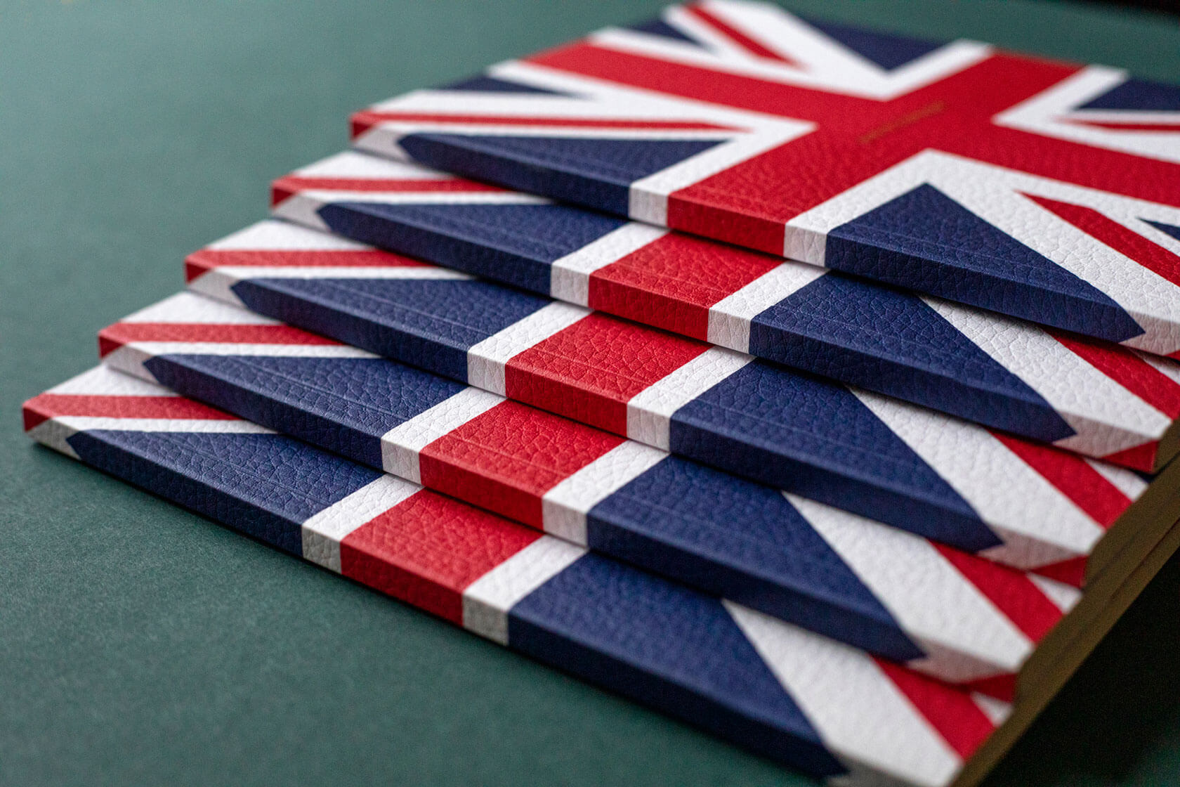 textured red white and blue union jack luxury notebooks stacked 
