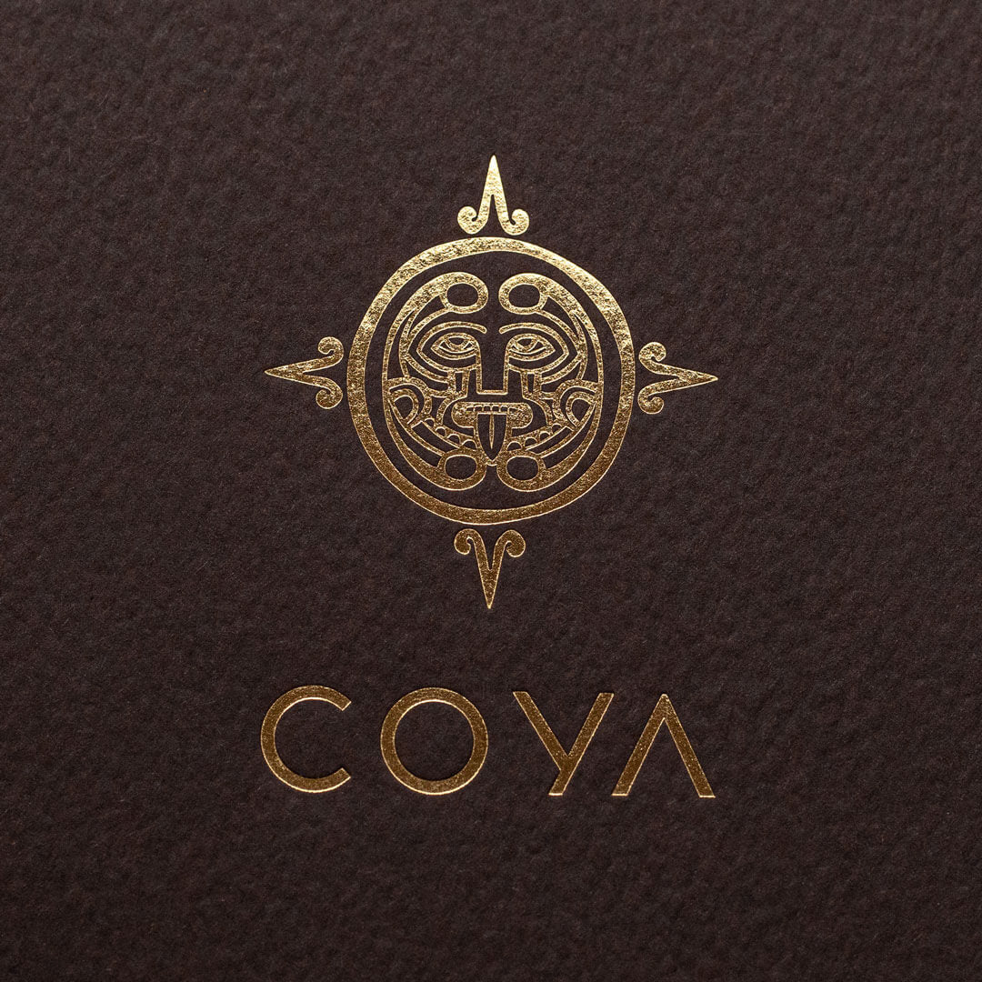 a premium quality picture of a gold foiled logo for the Mayfair restaurant COYA