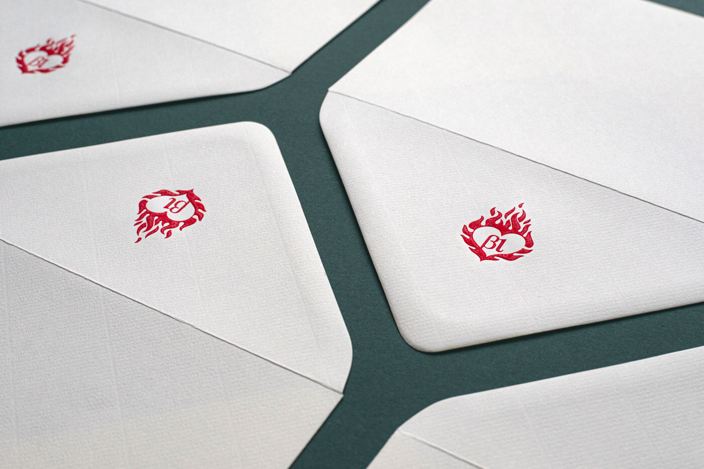 luxury die stamped engraved red logo on white envelopes