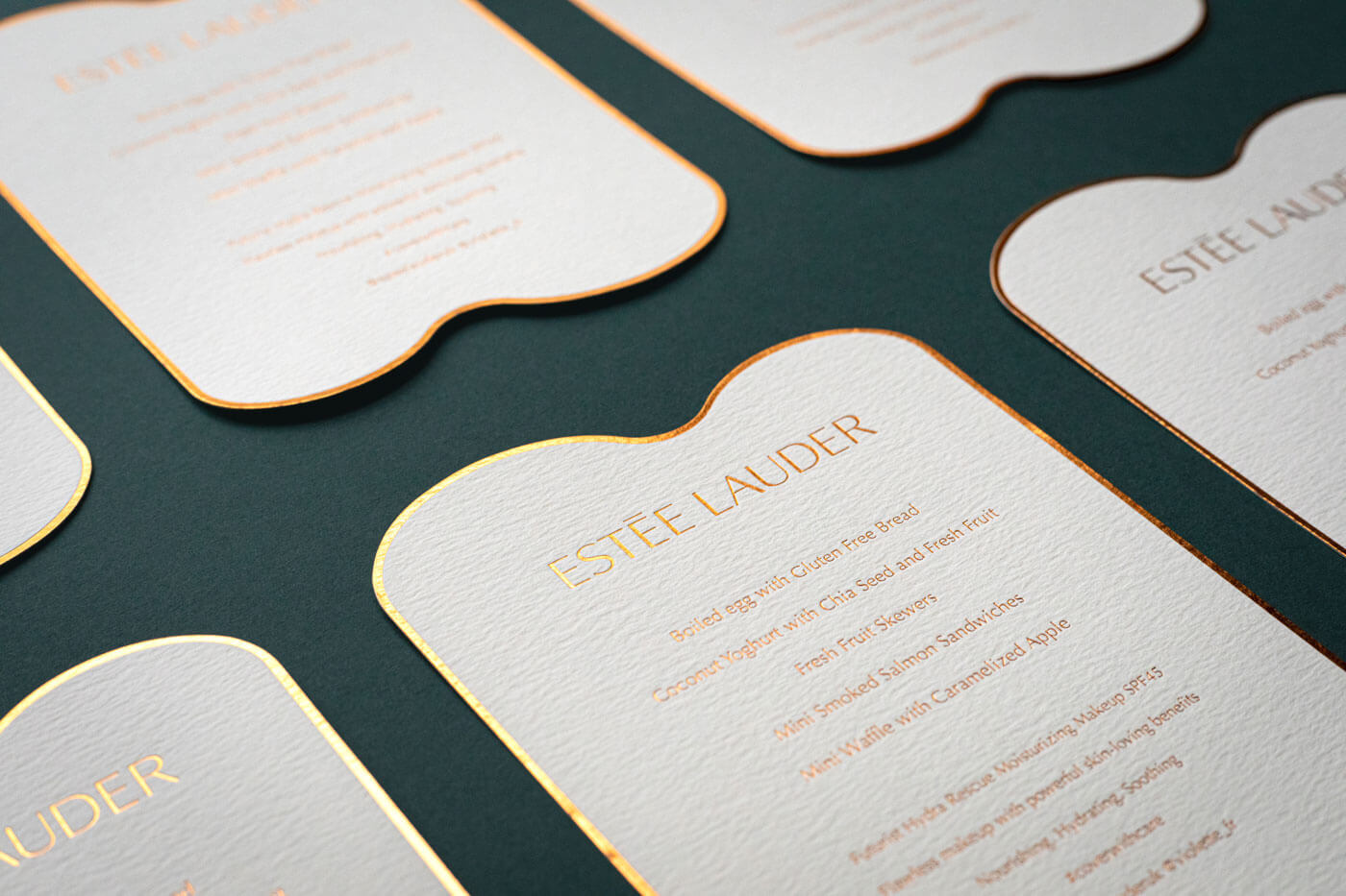 gold foil menu printed for an estee lauder event in london