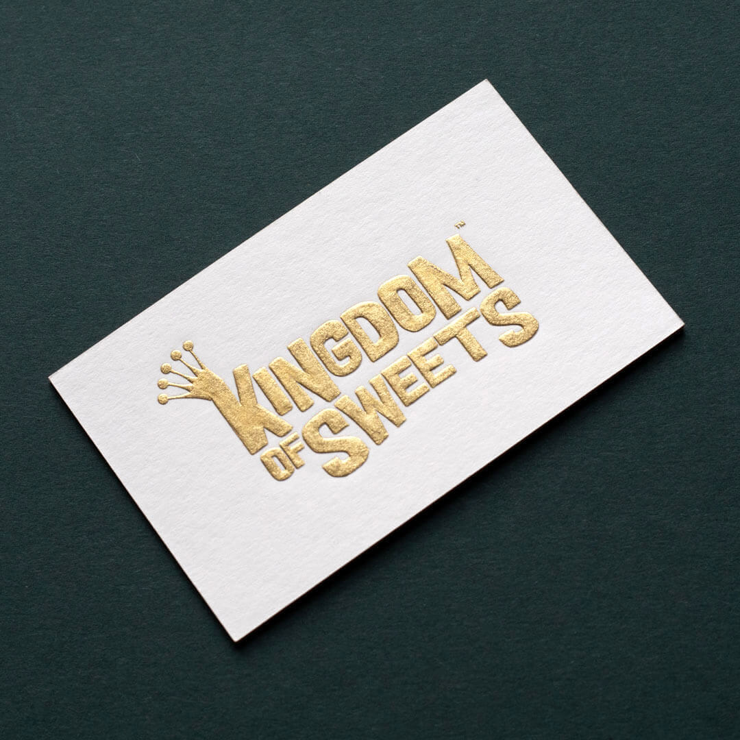 gold die stamped logo printed onto white corporate stationery