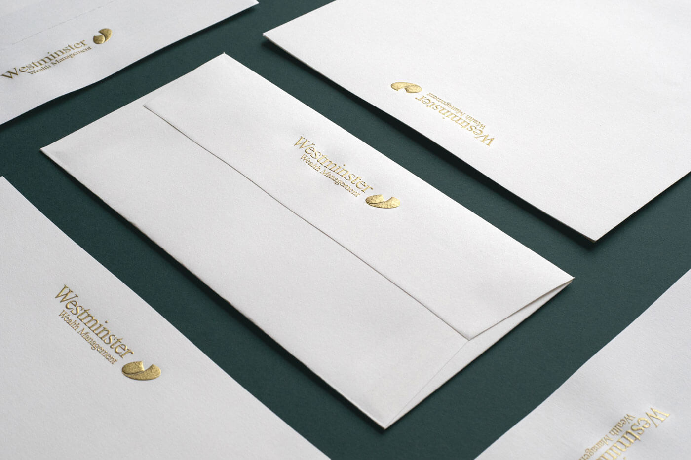 gold engraved logo on white envelopes