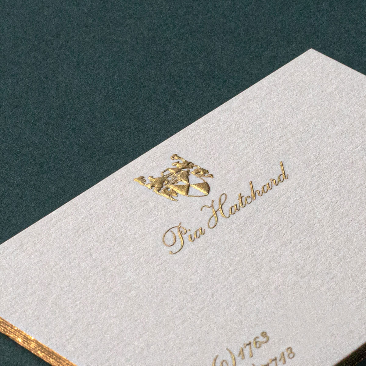 premium gold engraved printed logo and name on business card