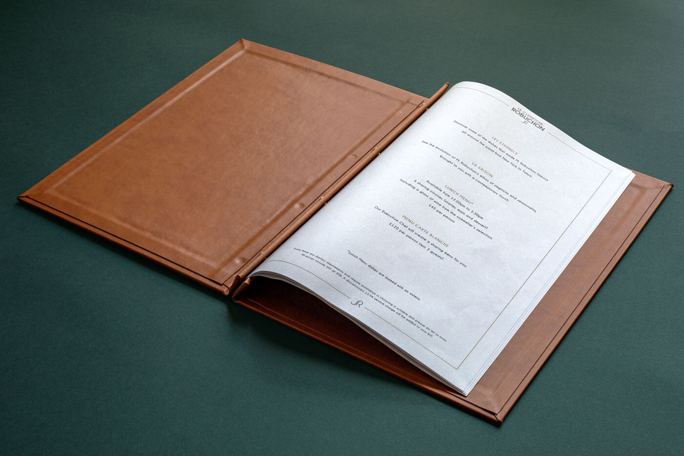 brown leather folder open showing printed menu sheets london