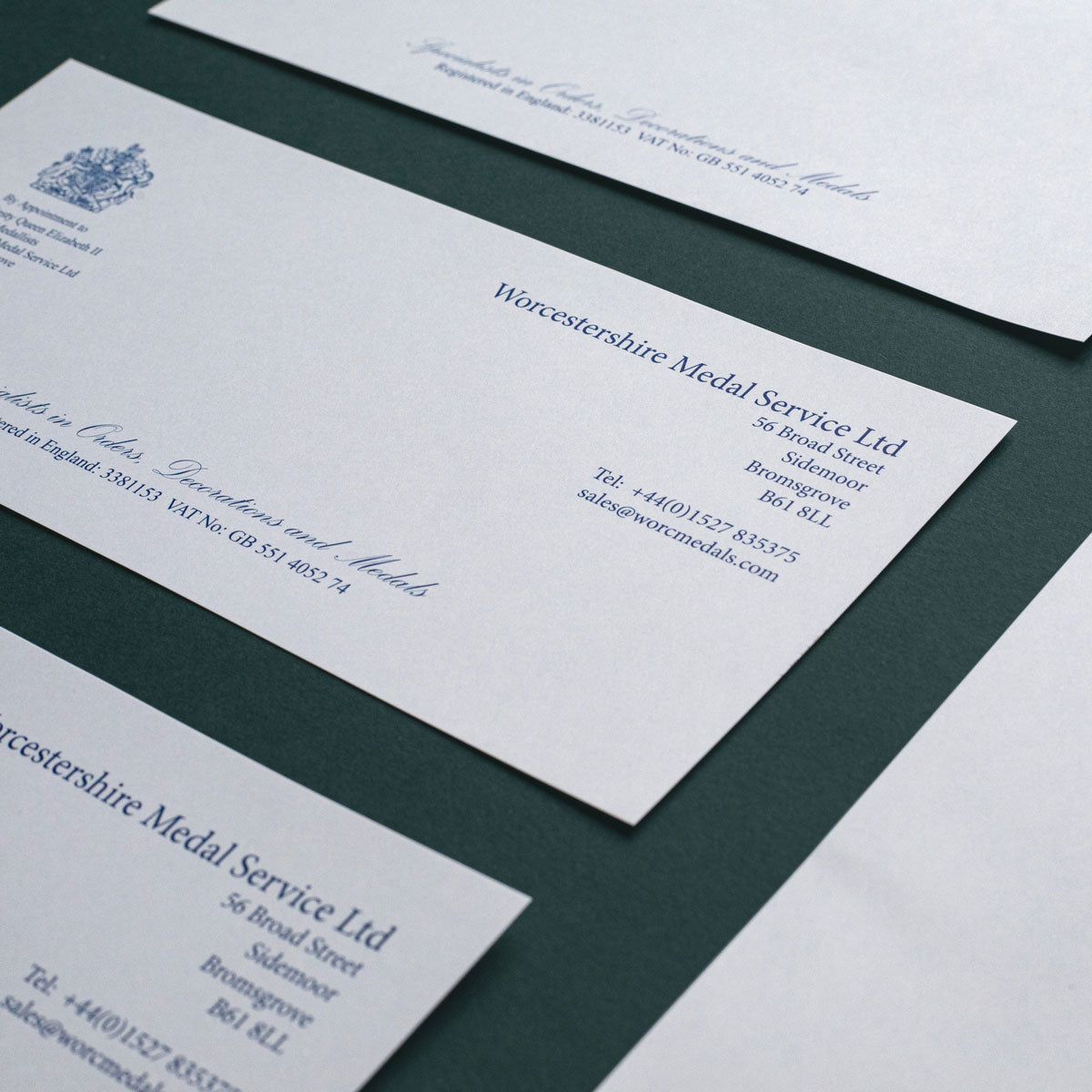 luxury compliment slip blue text printed on white paper