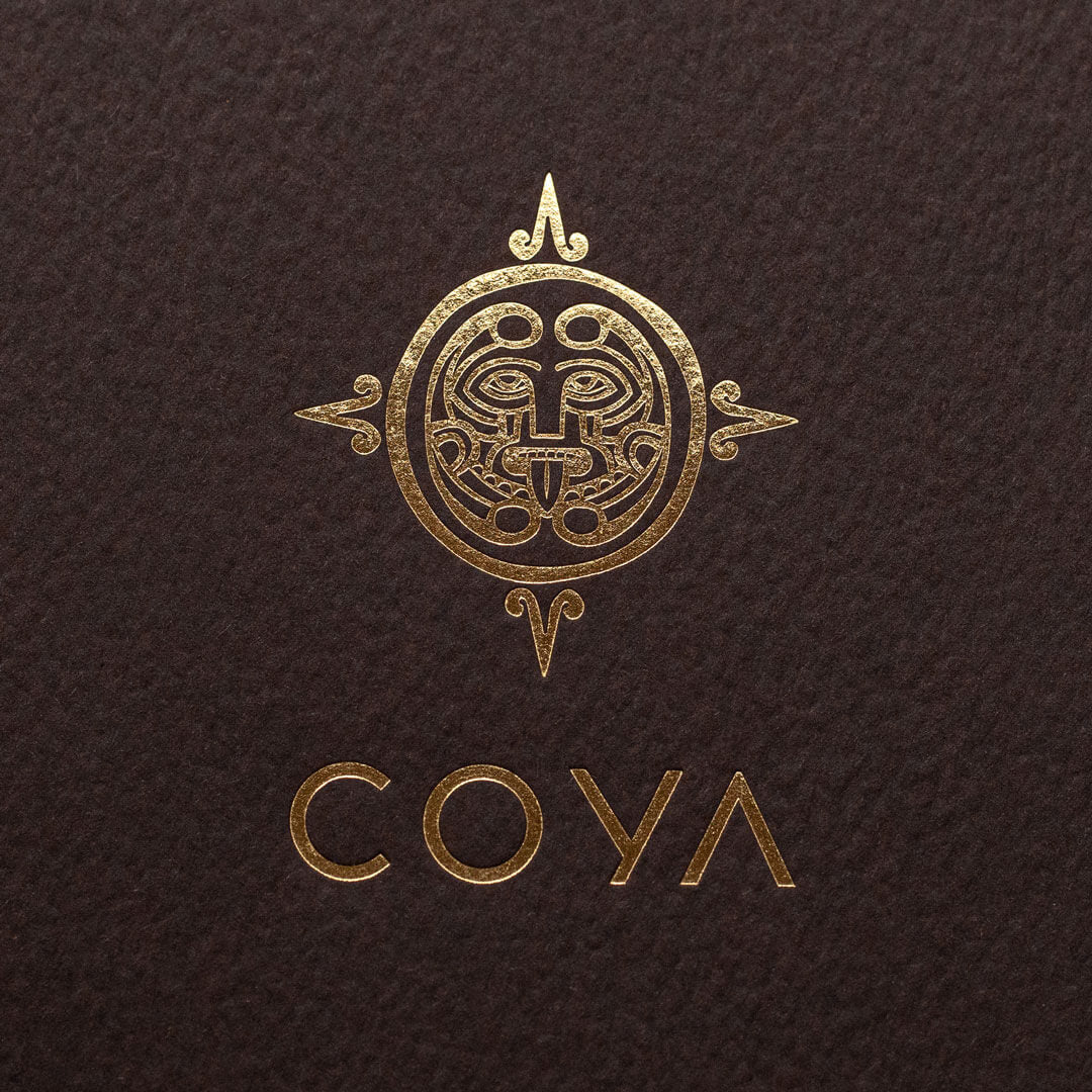 a premium quality picture of a gold foiled logo for the Mayfair restaurant COYA